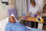 Environmental services worker in patient room