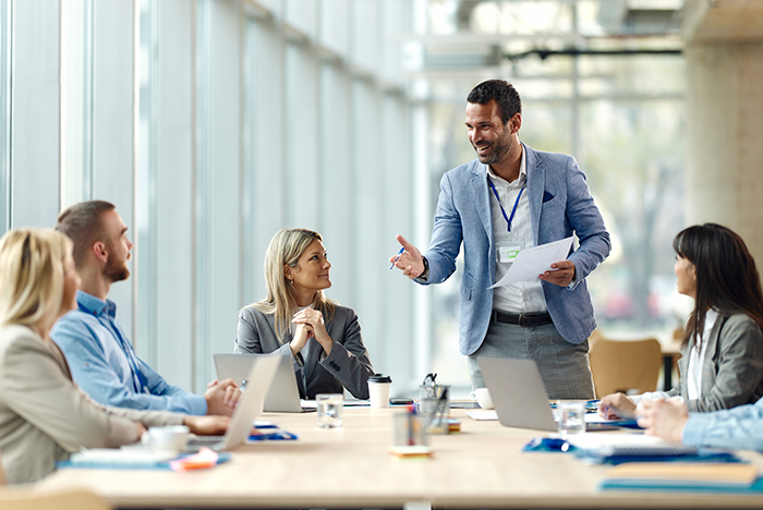 Male colleague leading meeting 