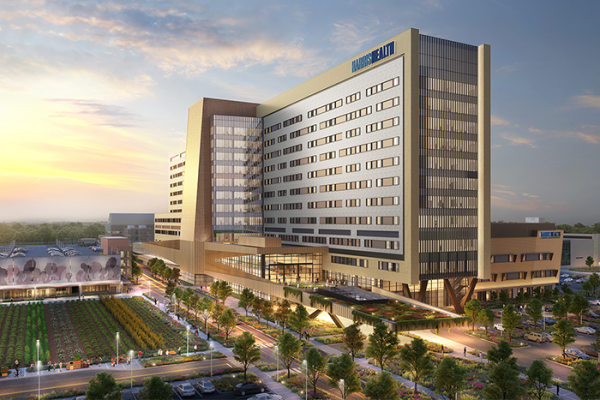 An architect's render of Harris Health LBJ Hospital at dusk. 