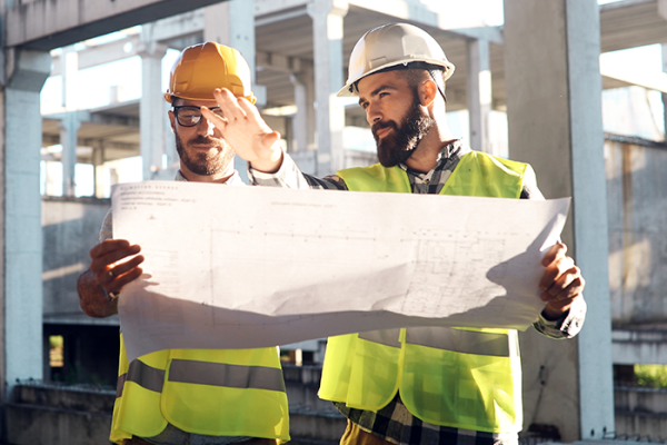 Two construction managers looking at plans