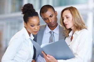 business people looking at documents