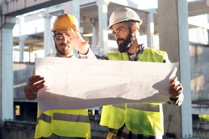 Two construction managers looking at plans