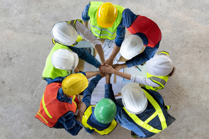 Construction workers with hands in