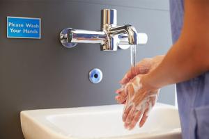 doctor washing at hospital sink